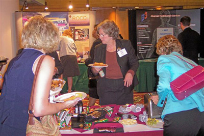 Jane Gonter (center) and other attendees during exhibit area break