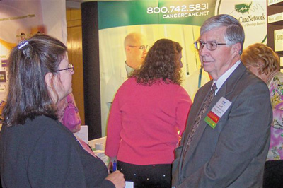 Dr. Carl Bogardus (R), Cancer Care Network, with SATRO attendee