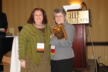 Director Marcia Phillips (L)  bestows annual chat group support award to Cindy Parman, CSI