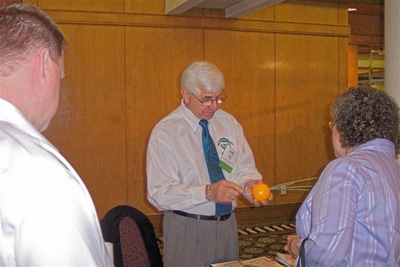 Alex Sabo (center), Best Medical, with SATRO attendees