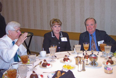Networking luncheon including attendee Dr. Alan Porter (R)