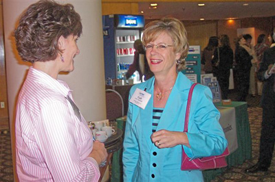Networking break in exhibit area, with Gail Satterfield, Charlotte, NC (R)