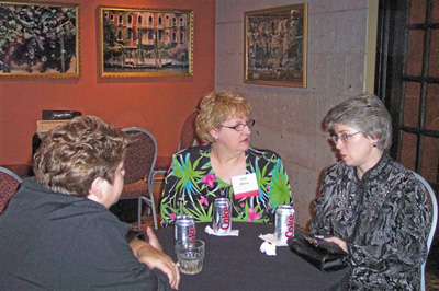 Dawn Fucillo (C), ASRT president, chats with Cindy Parman, CSI, (R)